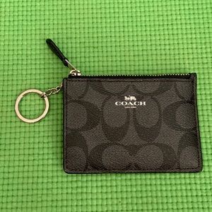 Coach black ID card keychain.